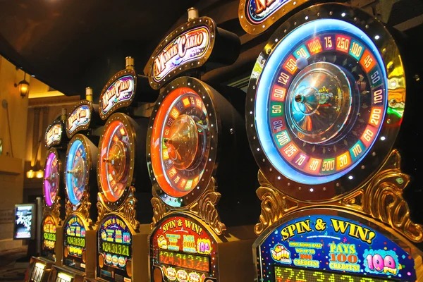 Live casino dealer at blackjack table with multiple camera angles